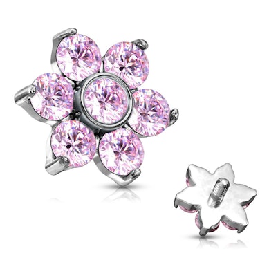 Dermal Anchor mit einer Blume geformt aus Steinen.
