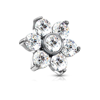 Dermal Anchor mit einer Blume geformt aus Steinen 